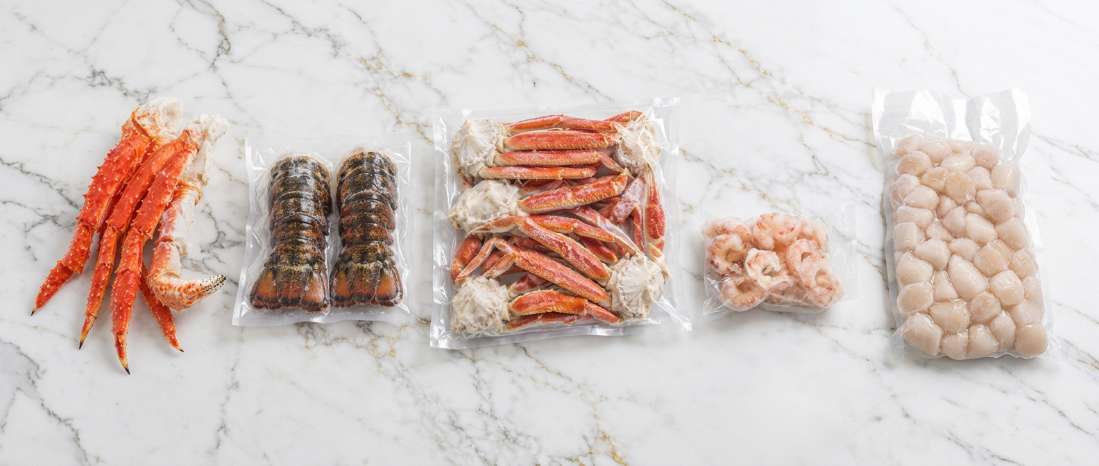King crab legs, lobster tails, snow crab clusters, shrimp and scallops arranged on a white marble surface